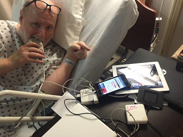 Picture of Ron eating the hospital bed remote control