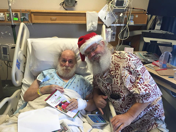 Picture of Ron Jacobs with Santa on Christmas Day in the hospital